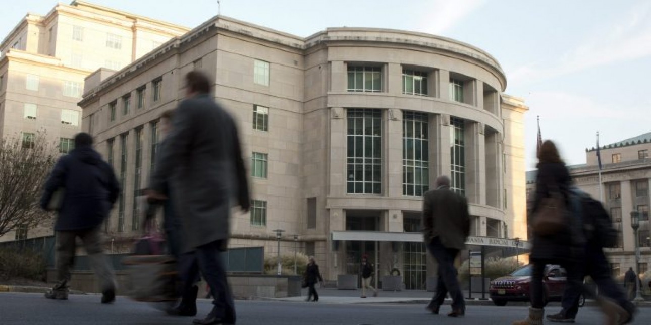 People walk by the Pennsylvania Judicial Center Tuesday, Dec. 8, 2015, at the state Capitol in Harrisburg. (Matt Rourke/AP Photo)